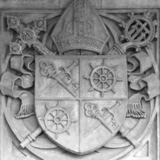 Relief of coat of arms of František Saleský Bauer on the north facade of the Cathedral of Saints Peter and Paul in Brno