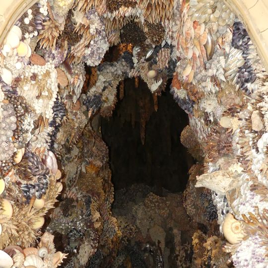 Grotto in recess right of lobby between stable yard and Chapel