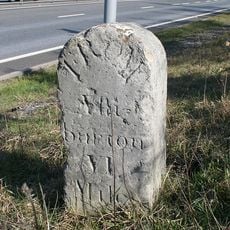 Milestone, Drumbridges roundabout, 50m down from exit slipway