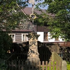 Wayside cross at the house no 66
