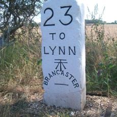 Milestone, 250yds W of entrance to First Staithe Field, 4yds E of large ash tree