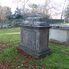 Group of 2 monuments in the churchyard approximately 8 metres south west of porch to Church of St John the Baptist