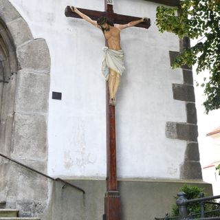 Crucifix in front of the church of Saint Martin