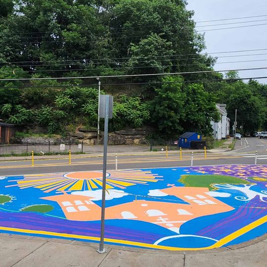 Bikes and Books asphalt art mural
