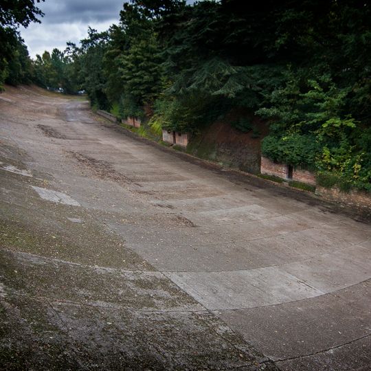 Brooklands motor racing circuit, remains of the pre-World War II aerodrome, World War II Bofors tower and shelters, and the Brooklands memorial