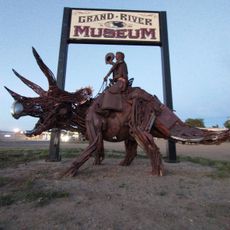 Cowboy Riding a Dinosaur