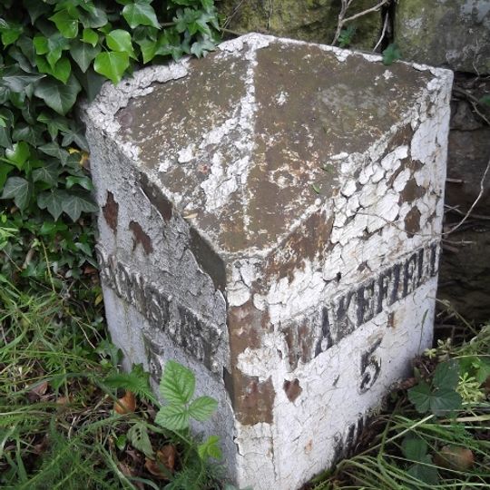 Milestone, 175m N of Woolley X-roads, adj SLOW on road