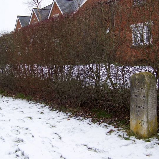 Milestone, The Street; 10m W of jcn Martins Rise