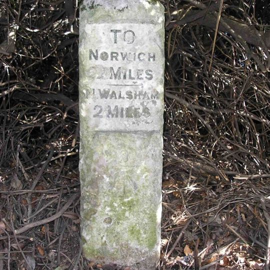 Milestone, 18yds N of end of crash barrier alongside lake