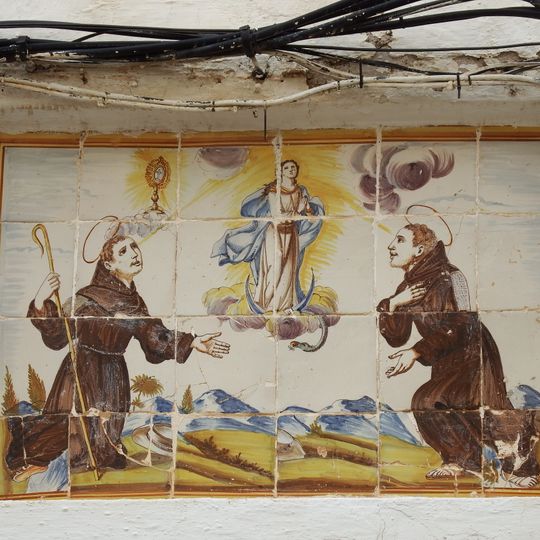 Ceramic panel of the Immaculate and two Franciscans