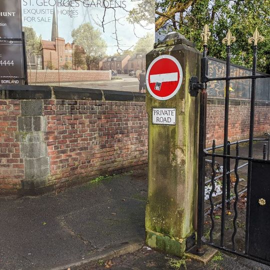 Wall and gate piers to St George's Church Schools and St George's Church