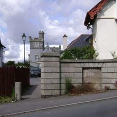 Entrance Wall And Gate Piers To East Of Yannon Towers