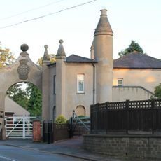 The Lodge And Attached Gateway And Wall