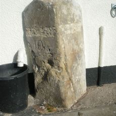 Milestone, by newsagents, No. 65 Melbourne Road, opp. Valley Road