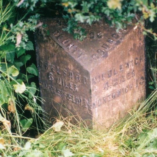 Milepost, roadside at SJ769673