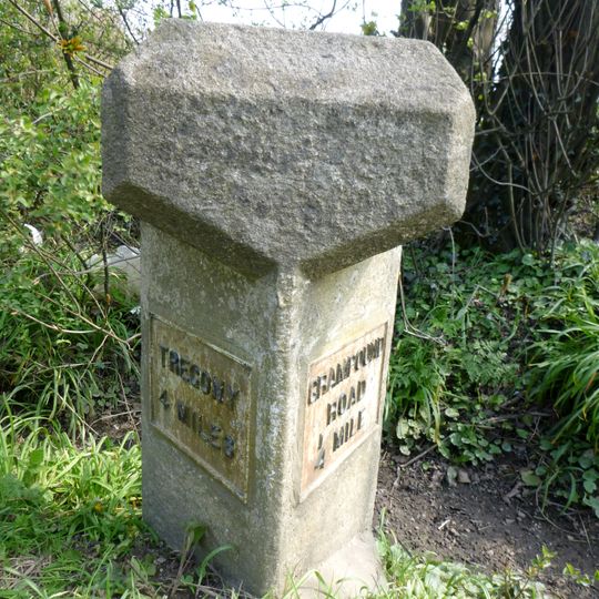 Milestone, S of Grampound Road village sign