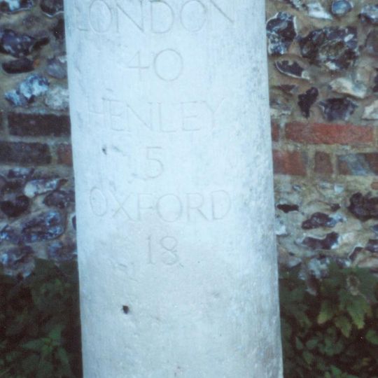 Milestone, High Street; W of church, E of petrol station