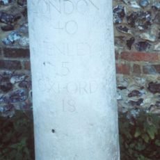 Milestone, High Street; W of church, E of petrol station