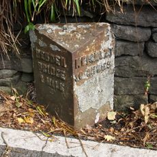 Milestone on east side of road half a mile (approximately) to north of junction with Midgehole Road