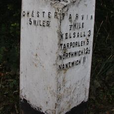 Milepost, E of on roundabout jct of A54 & A51