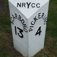 Milestone, Wilton village, at Hollies Farm