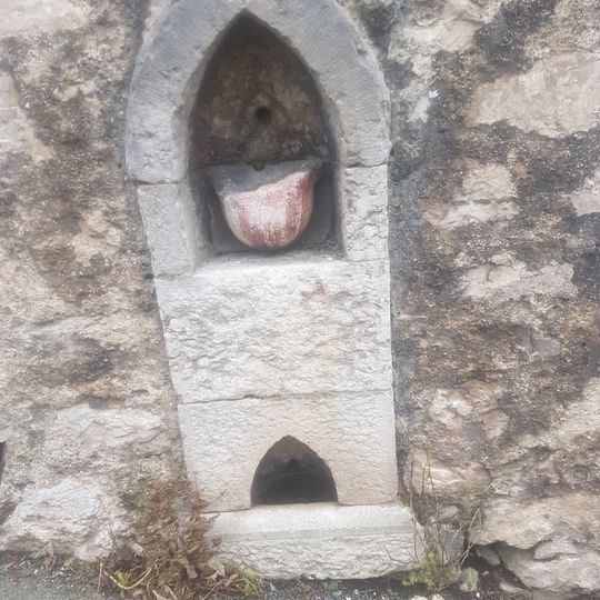 Retaining wall to garden to rear of No13, including drinking fountain