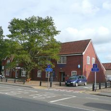 Barclays Bank and three adjoining tenements to north
